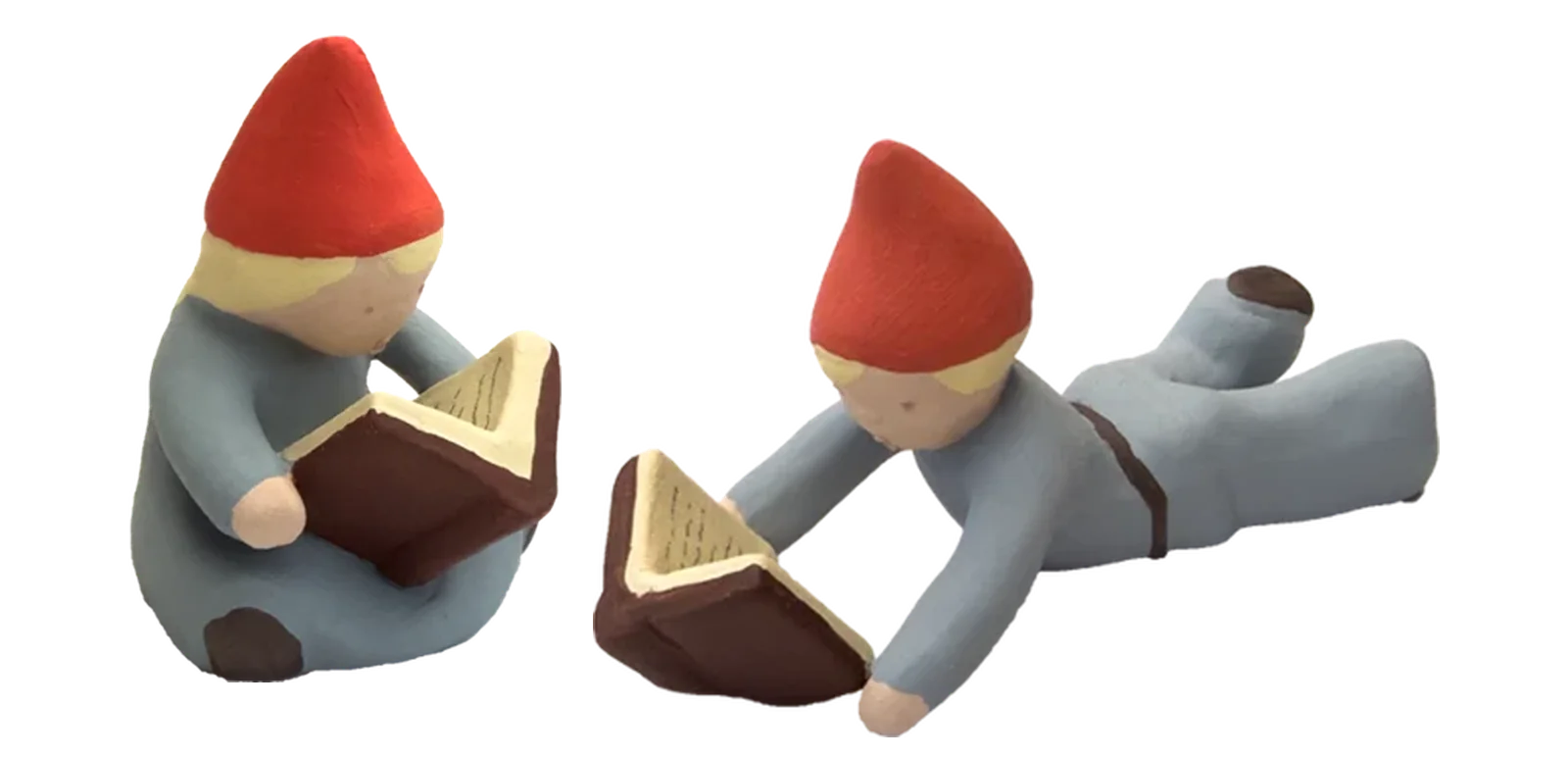Två nya figurer: tomteflicka och tomtepojke som läser
